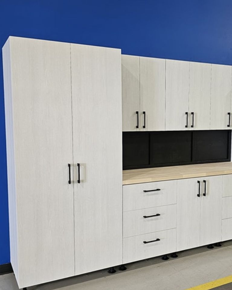 Blue garage with luxury white cabinets