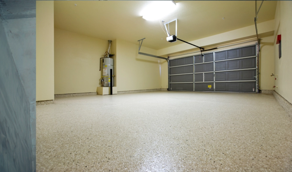 Garage floor coated with a garage door